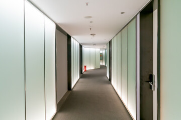 A modern office building with glass doors and windows