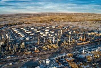 Aerial View of Wind Turbines lurking behind an Oil Refinery in Casper, Wyoming