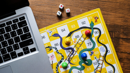Close-up of snakes and ladders game children playground.