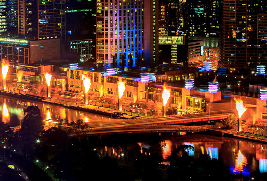 High Angle View Of Illuminated City Buildings And Fire Gas Brigades Show At Night