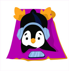 A cute penguin lies on the beach. Penguin listens to music with headphones.