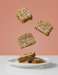 slices of wholemeal bread floating in the air. Light food concept and healthy eating.