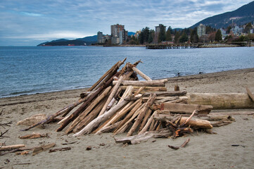 Fototapeta na wymiar Image of the Driftwood Forts on the beach. West Vancouver BC Canada 
