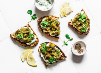 Smashed grilled eggplant bruschetta with yogurt herbs sauce - delicious appetizers, snacks, tapas...