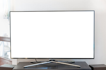 Close-up Of Blank Television Set On Table Against Wall At Home