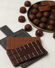 Chocolate and chocolate candy. Different chocolates and candies for coffee and tea.