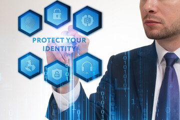 Business, Technology, Internet and network concept. Young businessman working on a virtual screen of the future and sees the inscription: Protect your identity