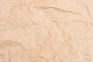 Crumpled brown paper texture. Brown background