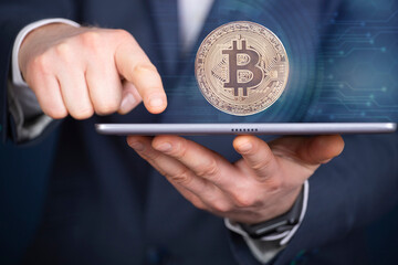 Businessman pointing digital bitcoin icon. Cryptocurrency exchange trading