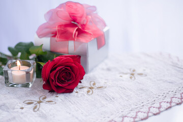 Gift box, rose flower and candle in the atmosphere of the Valentine's day festival