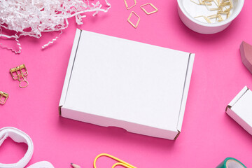 white Cardboard box on color office desk