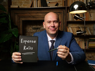  Expense Ratio phrase on black notepad.