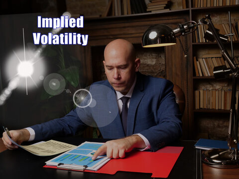 Financial Concept About Implied Volatility . Closeup Portrait Of Unrecognizable Successful Businessman Wearing Formal Suit Reading Documents