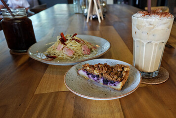 Blueberry crumble pie and Ham bacon pasta served with Iced Americano and Latte