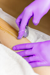 beauty salon hand hair removal close-up