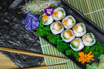 Delicious hossomaki on the decorated plate