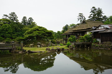 Fototapeta na wymiar Japanese garden and Moat at Hikone castle in Shiga Prefecture, Japan - 彦根城 お堀 城壁 日本 滋賀
