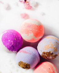 multicolored bath bombs on a light background