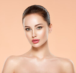Portrait of beautiful young brunette woman with clean face. Closeup face of young adult woman with...