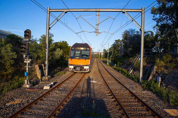 Commuter Train fast moving through a Station in Sydney NSW Australia