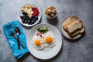 Healthy breakfast food ingredients on a background. Top view, selective focus.