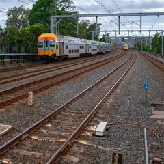Commuter Train fast moving through a Station in Sydney NSW Australia