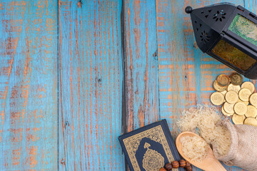 Holy Quran with arabic calligraphies translation meaning of Al-Quran, Coins, Rosary and Rice. Zakat...