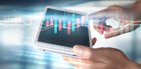 Graph growth and increase of chart positive indicators in his business,tablet in hand