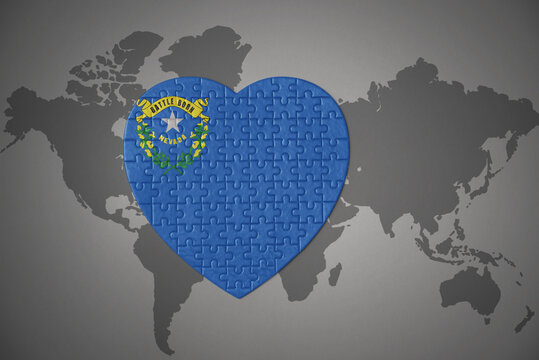 Puzzle Heart With Flag Of Nevada State On A World Map Background.