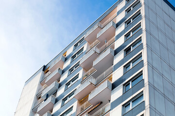 Facade of city apartments. Urban apartment complex. Detail of the facade of a multi story residential building. Apartment house, old architecture, residential building. Germany, Mainz, Rhineland 