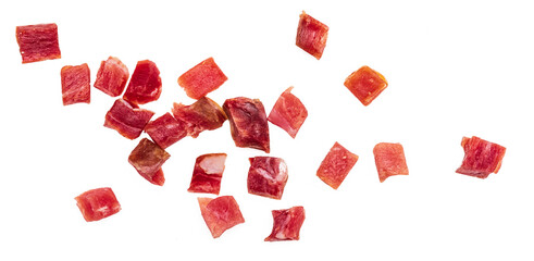 Iberian ham (serrano) cut into cubes (diced). Isolated on white background.