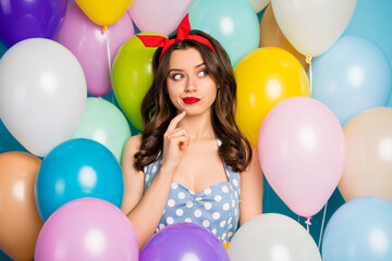 Close up photo of minded funky dreamy girl think thoughts about festive holiday event hesitate doubt touch chin fingers wear dress tank-top red on air baloons background © deagreez