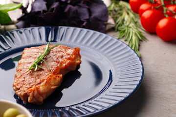 Grilled beef steak served on blue plate