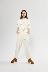 woman spread her legs and white jumpsuits fashion clothing style