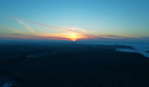 Top view of sunset over winter black forest © Payllik