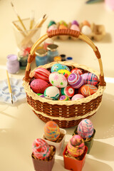 Fototapeta na wymiar Group of easter eggs painted with handmade and bright color in basket
