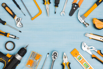 Tools set on blue background with copy space in center