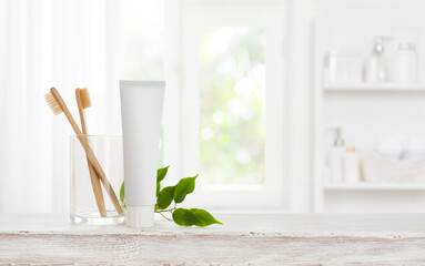 Eco bamboo toothbrushes and toothpaste tube mockup with copy space