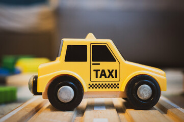 Yellow plastic toy taxi