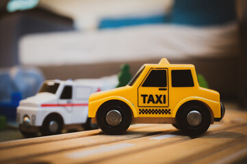 Yellow plastic toy taxi
