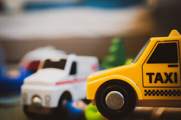 Yellow plastic toy taxi