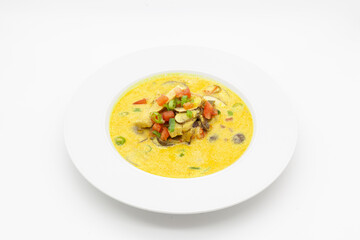 Low carb Curry soup with chicken, coconut milk, champignons, and chilli pepper