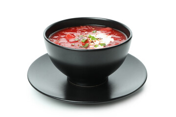 Bowl of beetroot soup isolated on white background
