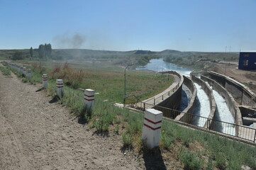 Zhambyl region, Kazakhstan - 05.15.2013 : Dam water discharge compartment at a hydroelectric power...