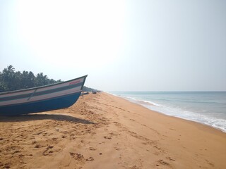 Fototapeta na wymiar Fishing boats on the seashore, seascape view Thiruvananthapuram Kerala