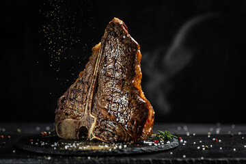 Aged Barbecue Porterhouse Steak. Beef T-Bone juicy steak rare beef with spices. American cuisine....