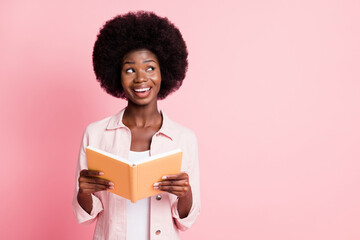 Portrait of lovely glad creative cheerful wavy-haired girl reading diary creating solution isolated...