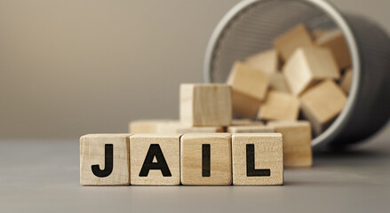 JAIL - word concept from wooden blocks on desk