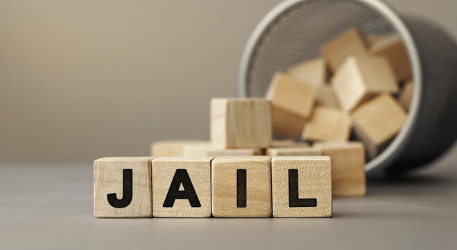 JAIL - Word Concept From Wooden Blocks On Desk