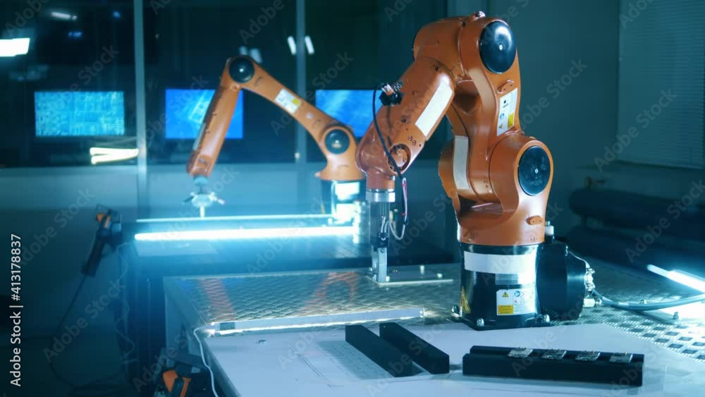 Wall mural functioning robotic arms in the science laboratory